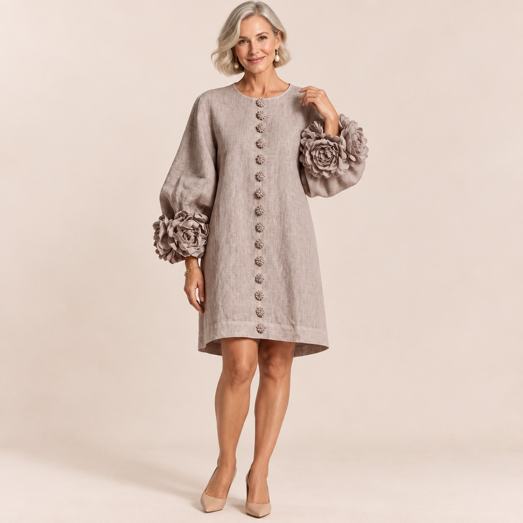 Woman wearing the Sadie easy-fit button-front dress with floral cuffs in mushroom taupe