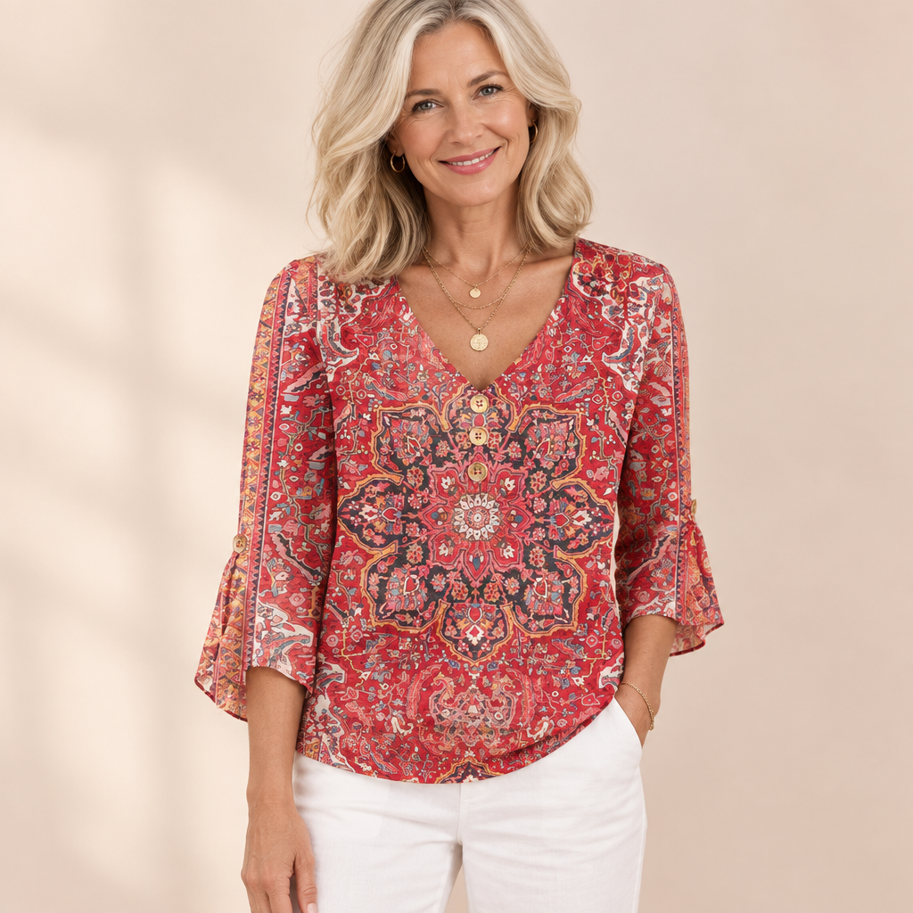Woman wearing the Loretta coral red boho print V-neck top with 3/4 sleeves