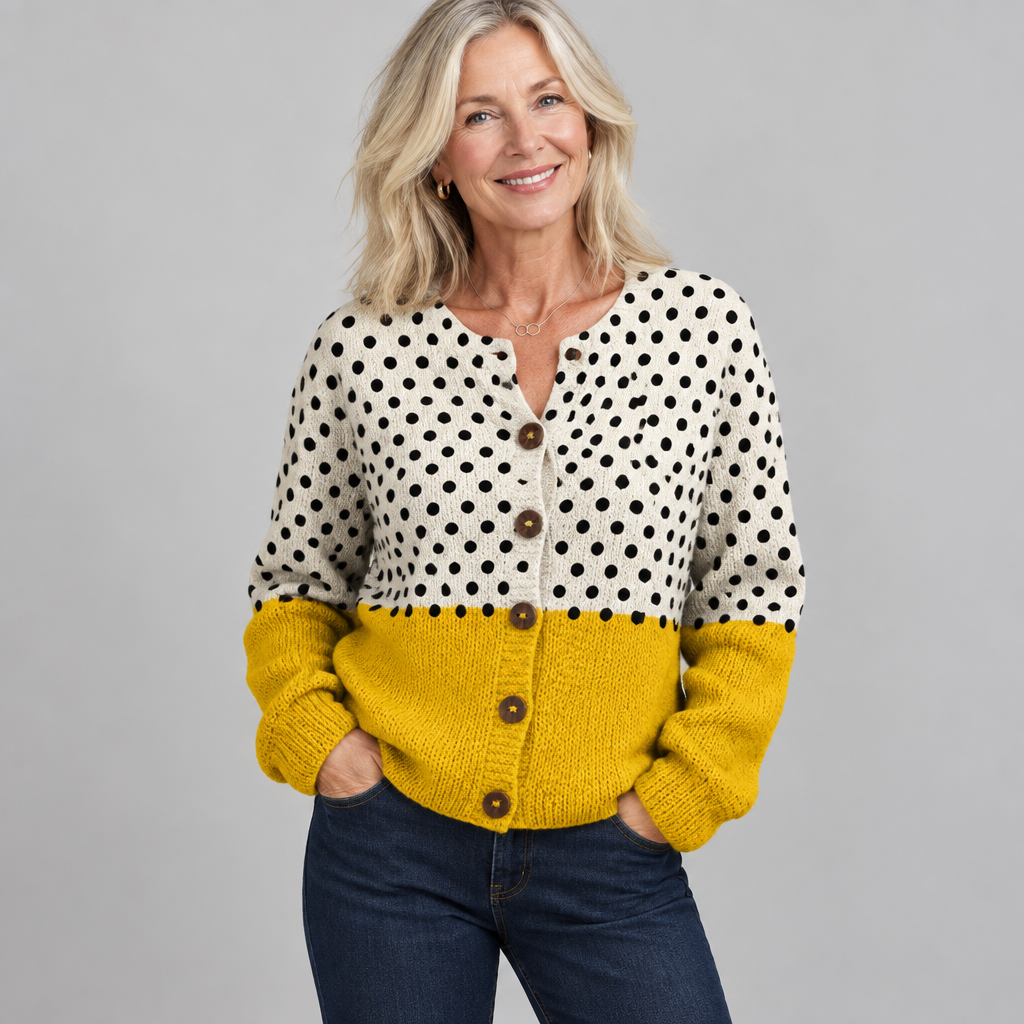 Woman wearing the Junella vintage polka dot cardigan in cream and mustard