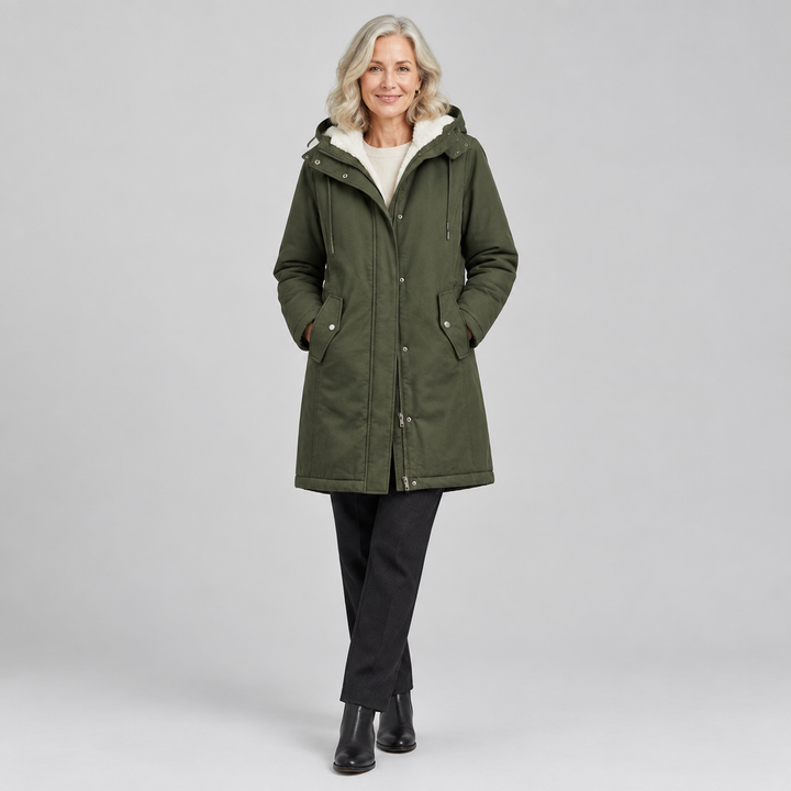 Woman wearing the Marjorie warm hooded longline coat with sherpa-style lining