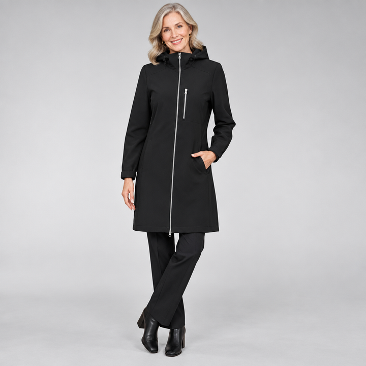 Woman wearing the Helen elegant long rain jacket, water-resistant and lightweight