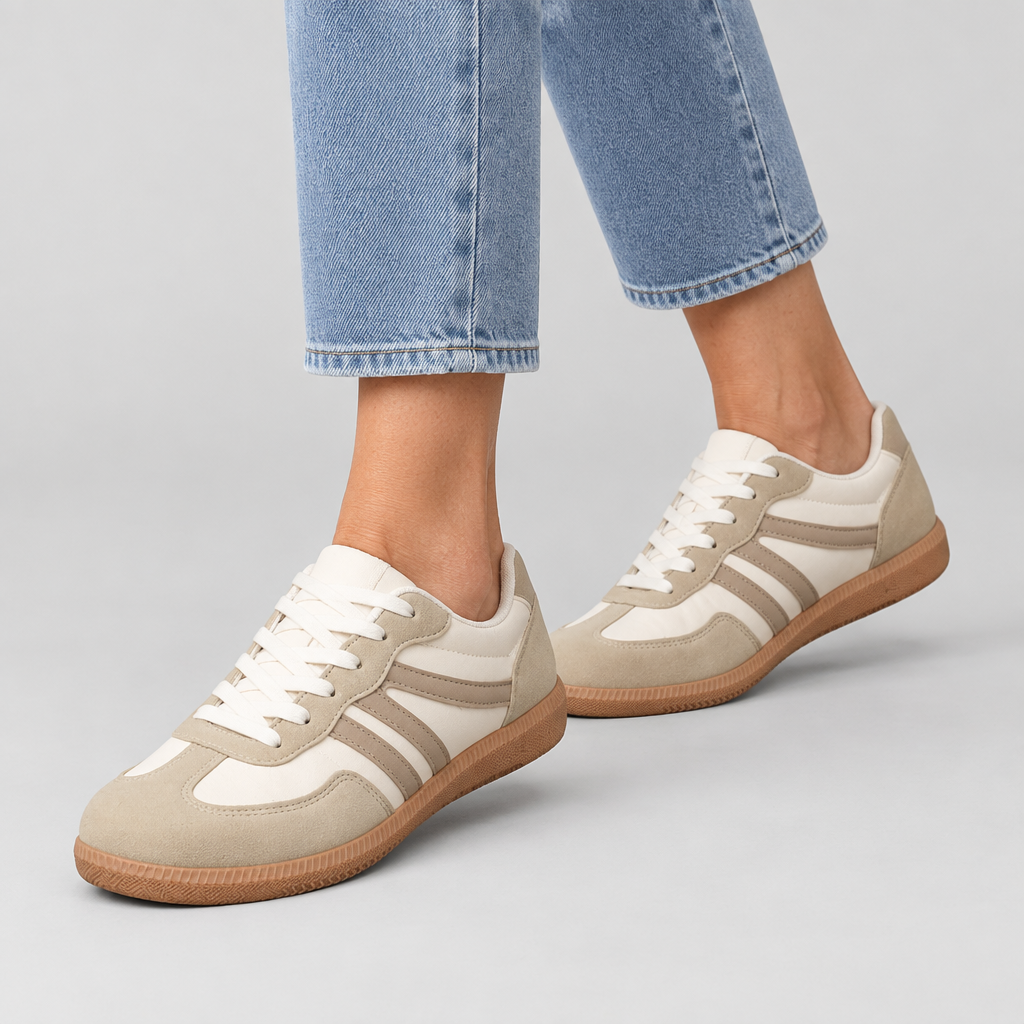 Woman wearing the Deliza wide toe box comfort trainers with jeans