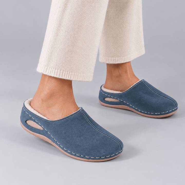 Woman wearing the Polerine orthopaedic cosy slippers