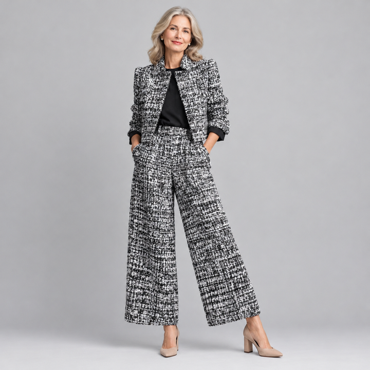 Woman wearing the Melize elegant two-piece trouser suit in black